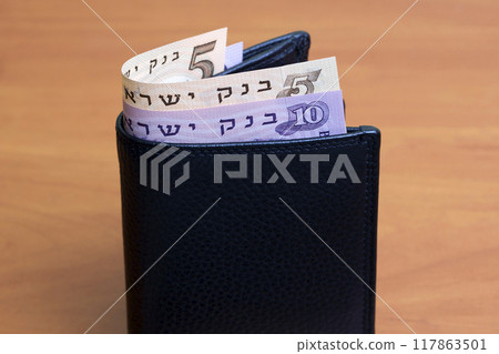 Israeli pound in the black wallet Israeli pound in the black wallet 117863501