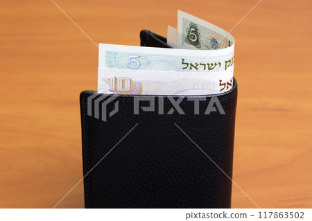 Israeli pound in the black wallet Israeli pound in the black wallet 117863502