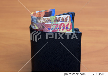Israeli new shekel in the black wallet 117863503