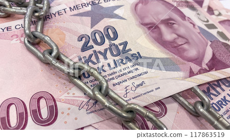 Security of Turkish Lira.Chained 200 TL Banknotes.200 TL Turkish Lira banknotes bound by a metal chain. Security of Turkish Lira.Chained 200 TL Banknotes.200 TL Turkish Lira banknotes bound by a metal chain. 117863519
