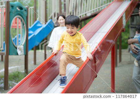 Children playing in the park with their mothers. Image of childcare and parenting. 117864017