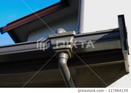 Rain gutter on the first floor of a house, from below Rain gutter on the first floor of a house, from below 117864139