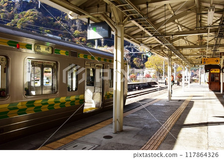 Annaka City, Gunma Prefecture, Shinetsu Main Line Yokokawa Station platform, trains parked, and Toge no Kamameshi Oginoya shop 117864326