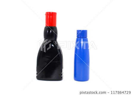 A picture of oil bottles isolated on white background with selective focus A picture of oil bottles isolated on white background with selective focus 117864729
