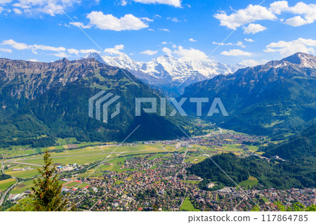 Breathtaking aerial view of Interlaken and Swiss Alps from Harder Kulm viewpoint, Switzerland Breathtaking aerial view of Interlaken and Swiss Alps from Harder Kulm viewpoint, Switzerland 117864785