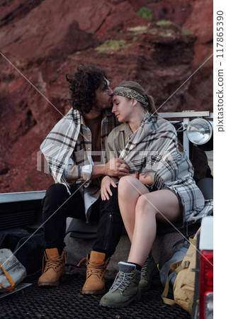 Young man kissing his restful girlfriend 117865390