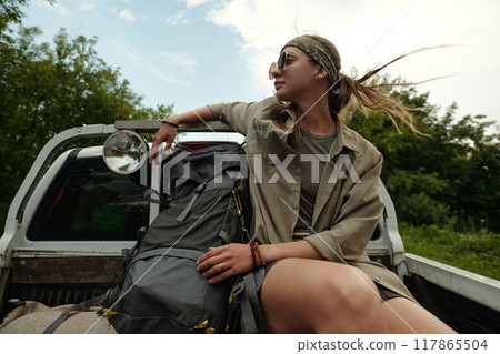 Enjoying hitchhiking trip in vehicle Enjoying hitchhiking trip in vehicle 117865504