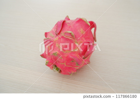 Dragon fruit on wooden table. Top view. Healthy food concept. Dragon fruit on wooden table. Top view. Healthy food concept. 117866180