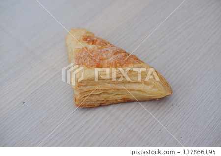 Puff Pastry on a wooden table. Selective focus. Puff Pastry on a wooden table. Selective focus. 117866195