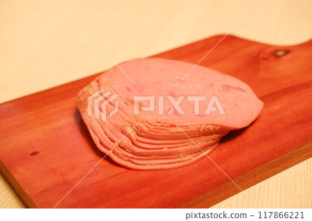 Slices of ham on a cutting board, closeup of photo Slices of ham on a cutting board, closeup of photo 117866221