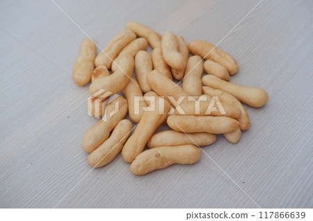 Close up of crunchy bread stick on wooden table background, stock photo 117866639