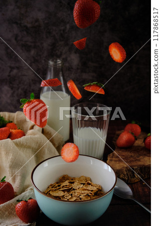 still life bowl of red ripe strawberries on a dark background still life bowl of red ripe strawberries on a dark background 117868517