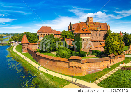 The Castle of the Teutonic Order in Malbork by the Nogat river. Poland The Castle of the Teutonic Order in Malbork by the Nogat river. Poland 117870150
