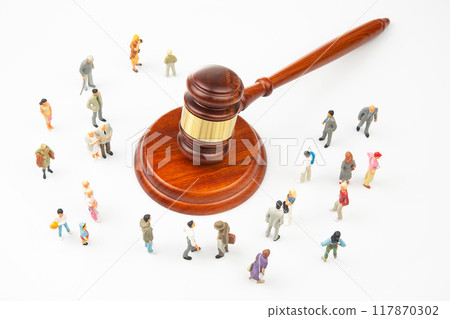 Miniature people. Many people near the gavel of law and justice Miniature people. Many people near the gavel of law and justice 117870302