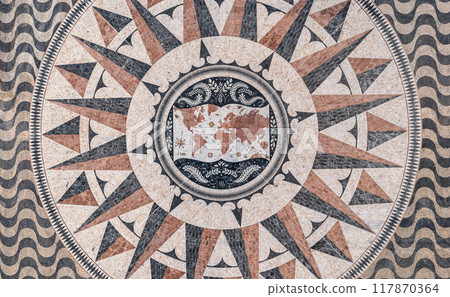 Aerial view of pavement map with routes of Portuguese explorations by Monument to Discoveries, Belem, Lisbon, Portugal, Europe. Antique map maritime motifs, compass, wind rose, image decorations 117870364