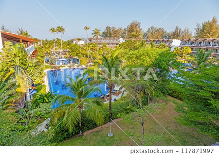 Panoramic picture of a hotel pool in a tropical garden of a vacation hotel Panoramic picture of a hotel pool in a tropical garden of a vacation hotel 117871997