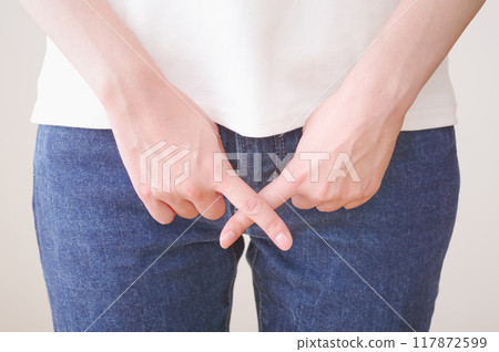 Woman showing cross on private parts Woman showing cross on private parts 117872599