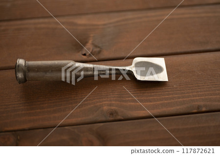 A well-used chisel measuring 1.4 inches A well-used chisel measuring 1.4 inches 117872621