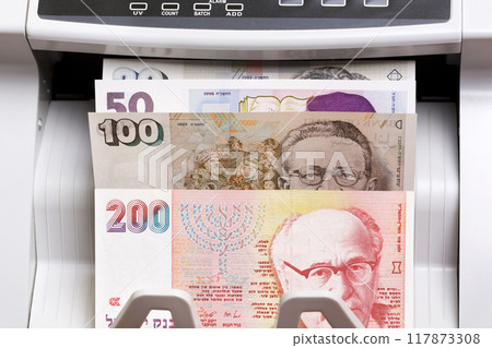 Israeli new shekel in the counting machine Israeli new shekel in the counting machine 117873308