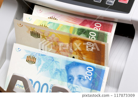 Israeli new shekel in the counting machine Israeli new shekel in the counting machine 117873309