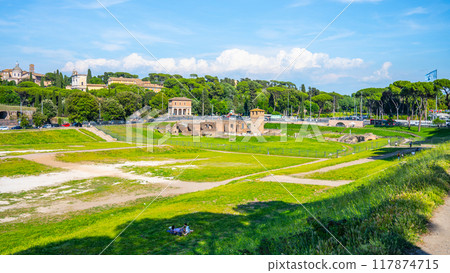 The Circus Maximus, Italian: Circo Massimo, an ancient Roman chariot-racing stadium and mass entertainment place in ancient Rome, Italy. With buildings of Palatine Hill on background 117874715