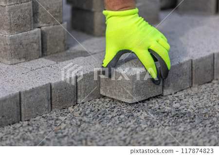 Man worker building a new path from concrete pavement, building concept Man worker building a new path from concrete pavement, building concept 117874823