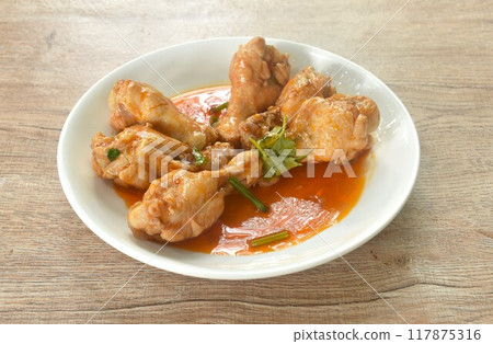 steamed chicken drumstick with sweet red gravy sauce on plate steamed chicken drumstick with sweet red gravy sauce on plate 117875316
