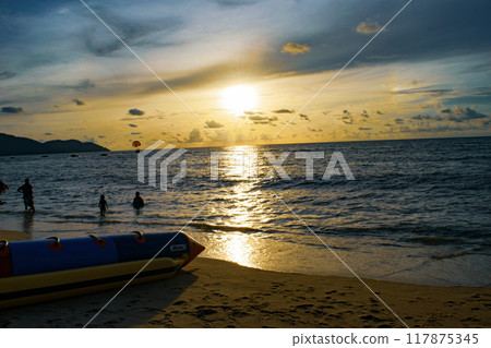 Radiant Splendor: Sun Rays Pierce Through a Vibrant Blue Sky Radiant Splendor: Sun Rays Pierce Through a Vibrant Blue Sky 117875345