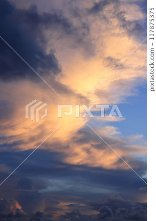 Nature Landscape Sunset, a vivid sunset between the blue sky and black clouds. The clouds are mainly stratocumulus clouds. Nature Landscape Sunset, a vivid sunset between the blue sky and black clouds. The clouds are mainly stratocumulus clouds. 117875375