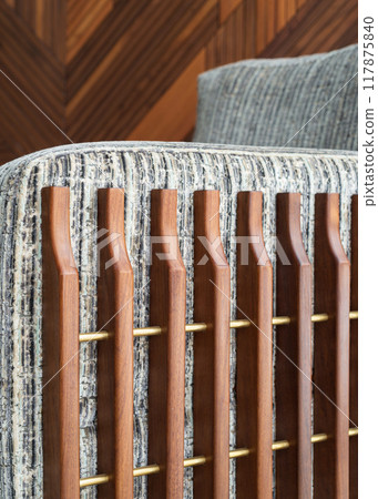 Elegant Wooden Slats Enhance the Modern Design of a Stylish Sofa in a Cozy Living Room Setting Elegant Wooden Slats Enhance the Modern Design of a Stylish Sofa in a Cozy Living Room Setting 117875840