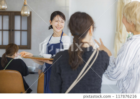 A cafe attendant giving directions A cafe attendant giving directions 117876216