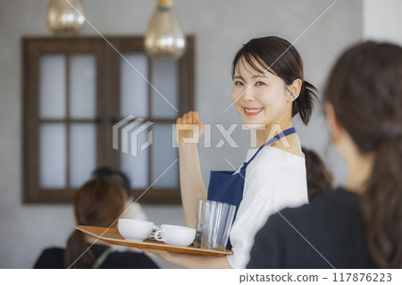 A cafe attendant giving directions A cafe attendant giving directions 117876223