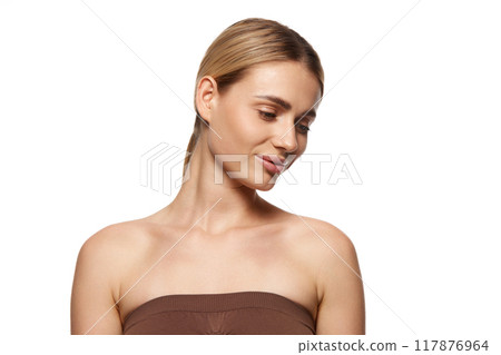 Essence of effective skincare and pursuit of aesthetic perfection. Portrait of beautiful young woman demonstrating perfect face 117876964