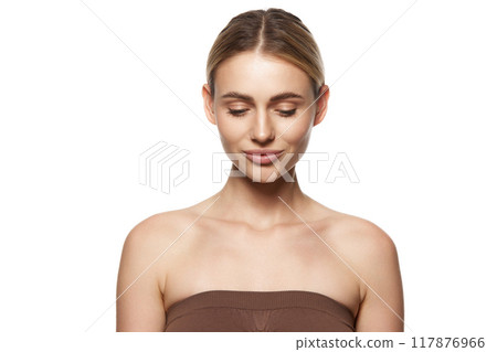 Portrait of young woman with flawless skin, showing beauty of clear, smooth complexion. Highlights impact of cosmetic routines and skin care. Portrait of young woman with flawless skin, showing beauty of clear, smooth complexion. Highlights impact of cosmetic routines and skin care. 117876966