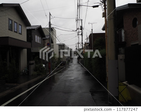 Uphill in a rainy residential area 117877247
