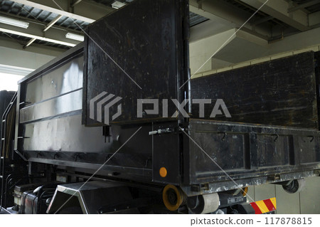 Workers working on a truck 117878815