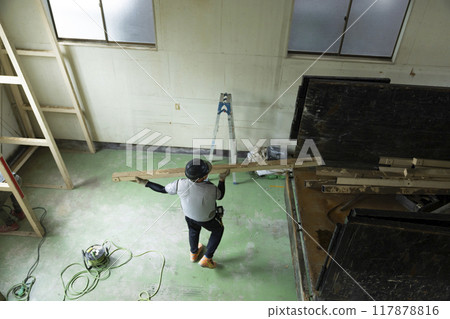 Workers working on a truck 117878816