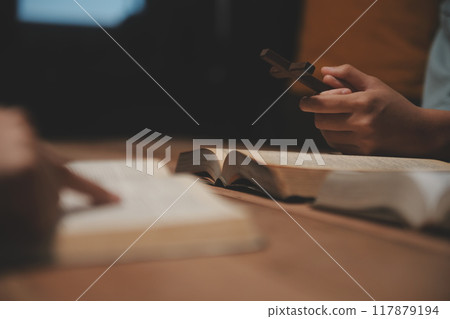 Christian group are praying to god with the bible and sharing the gospel. Concept of faith for god. Christian group are praying to god with the bible and sharing the gospel. Concept of faith for god. 117879194