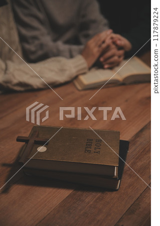 Christian group are praying to god with the bible and sharing the gospel. Concept of faith for god. Christian group are praying to god with the bible and sharing the gospel. Concept of faith for god. 117879224