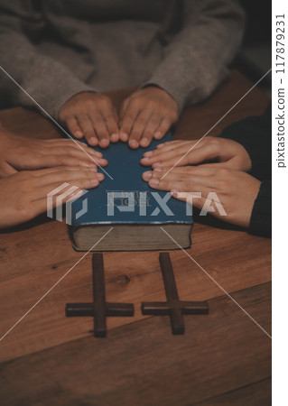Christian group are praying to god with the bible and sharing the gospel. Concept of faith for god. Christian group are praying to god with the bible and sharing the gospel. Concept of faith for god. 117879231