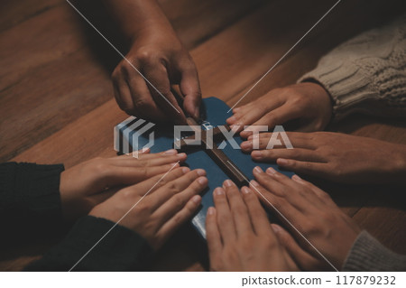 Christian group are praying to god with the bible and sharing the gospel. Concept of faith for god. Christian group are praying to god with the bible and sharing the gospel. Concept of faith for god. 117879232
