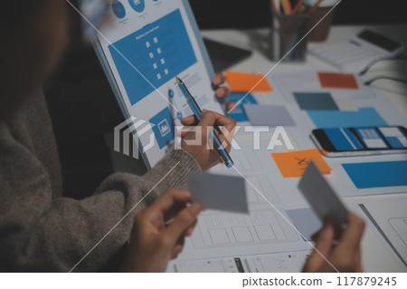 Professional interior designer at workplace in office, closeup 117879245