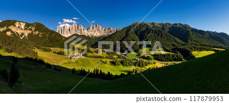 Santa Maddalena village with Dolomites alps mountains in background, Val di Funes valley, Italy, Europe 117879953