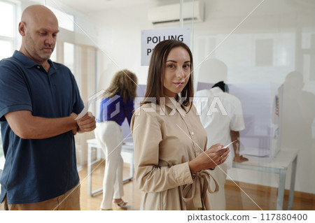 Woman Voting In Voting Centre Woman Voting In Voting Centre 117880400