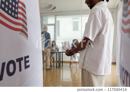 Man With Bulletin Voting During Election Man With Bulletin Voting During Election 117880416