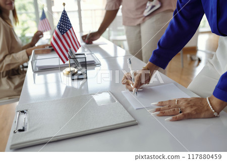 People Filling Documents And Voting People Filling Documents And Voting 117880459