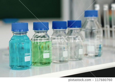 Scientific Laboratory Bottles Containing Various Liquids Scientific Laboratory Bottles Containing Various Liquids 117880760