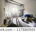 Interior Room Under Renovation with Debris and Tools 117880949