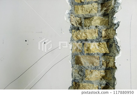 Exposed Brick Wall Section During Interior Renovation 117880950