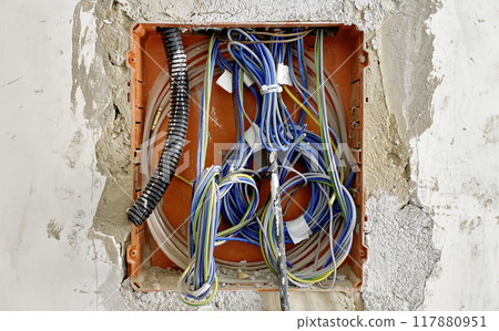 Close-Up of Exposed Electrical Wiring in Renovation Wall 117880951